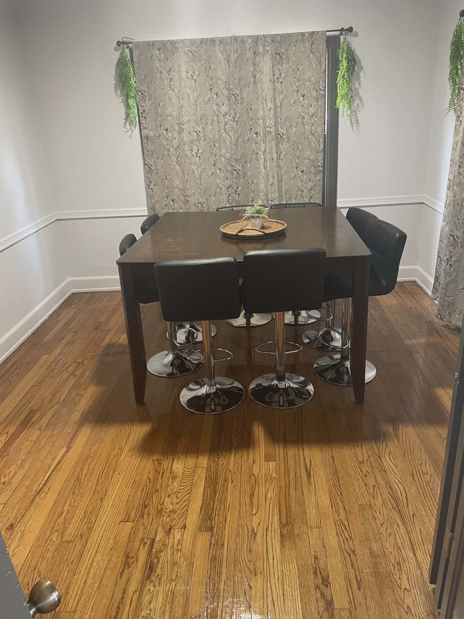 Polished dining room with gleaming hardwood