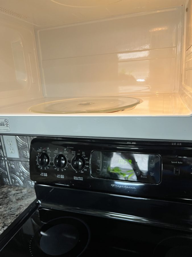 Inside of a microwave cleaned by Wayman and Shannon